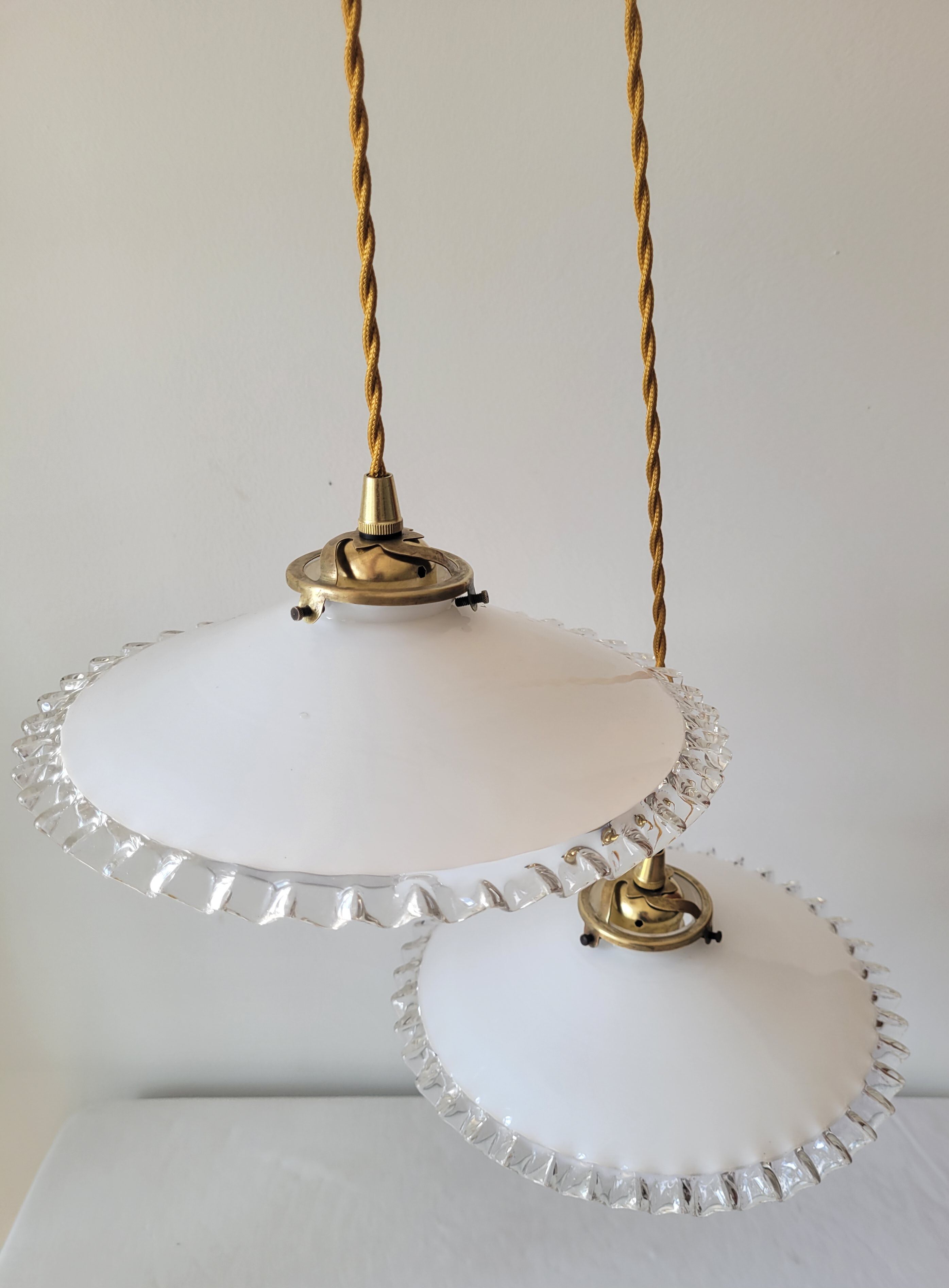 Duo of serrated opaline suspensions