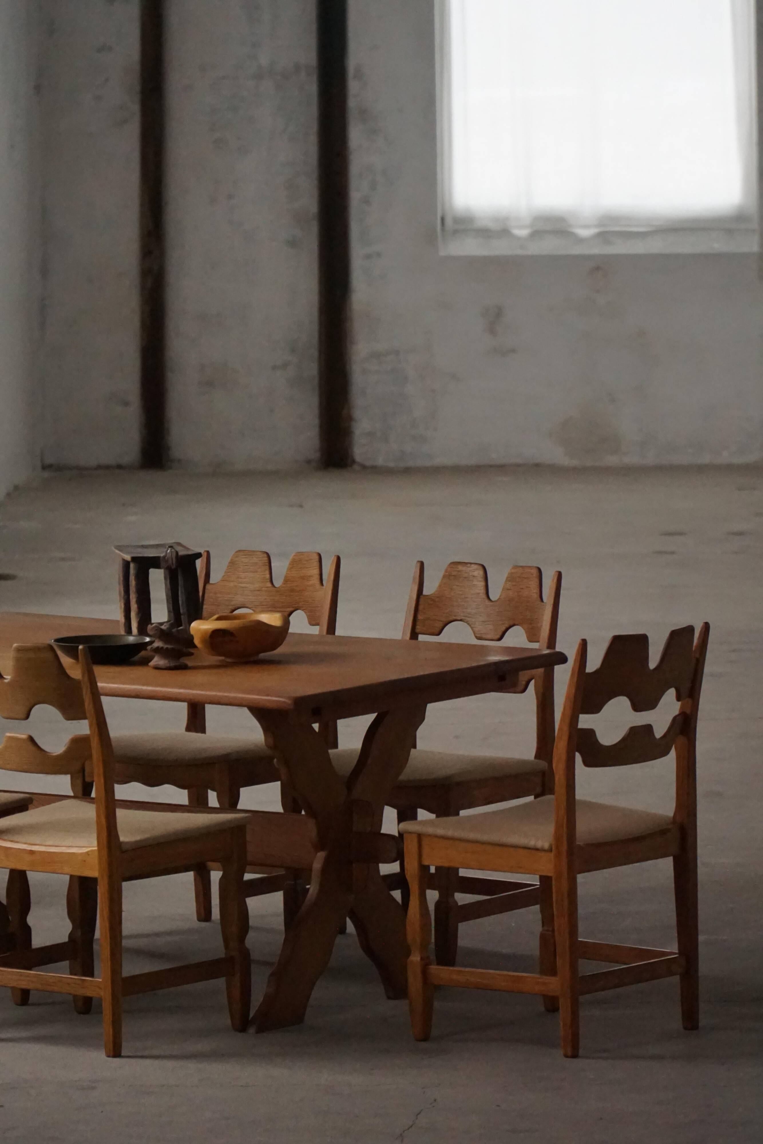 Solid oak dining table with cross base by Danish cabinetmaker, mid-20th century.