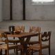 Solid oak dining table with cross base by Danish cabinetmaker, mid-20th century.