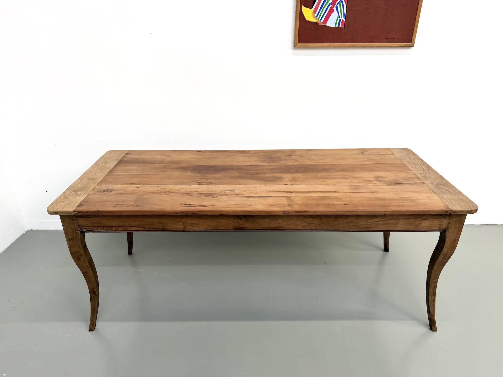 Farm table in solid cherry — Saber legs, Circa 1880
