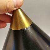 Cone pendant produced by Danish Lyfa in beautiful black lacquer with perforated shade and brass top.
