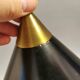Cone pendant produced by Danish Lyfa in beautiful black lacquer with perforated shade and brass top.