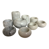 9 marble candle holders of different sizes
