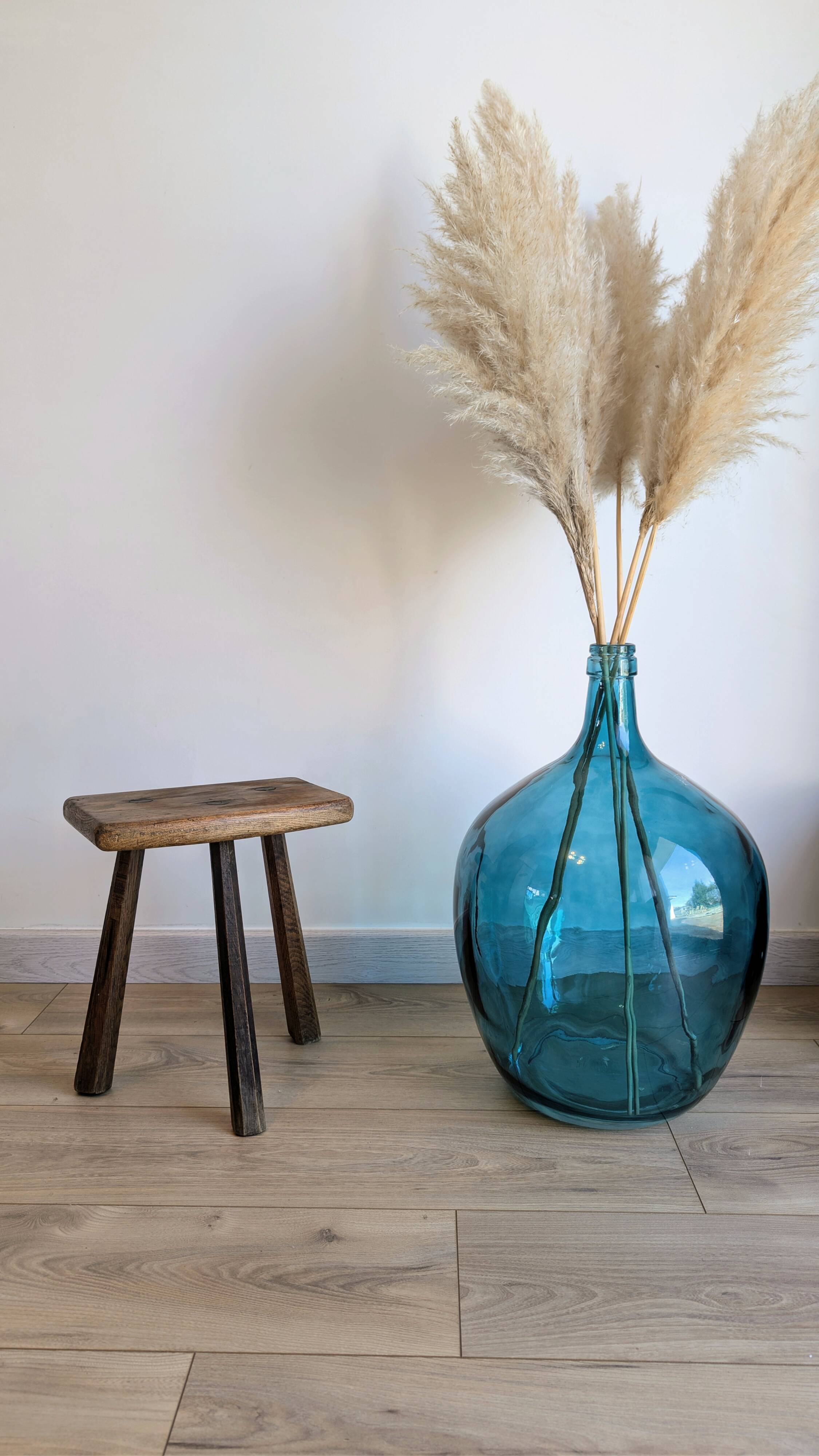 Antique tripod stool in patinated solid wood