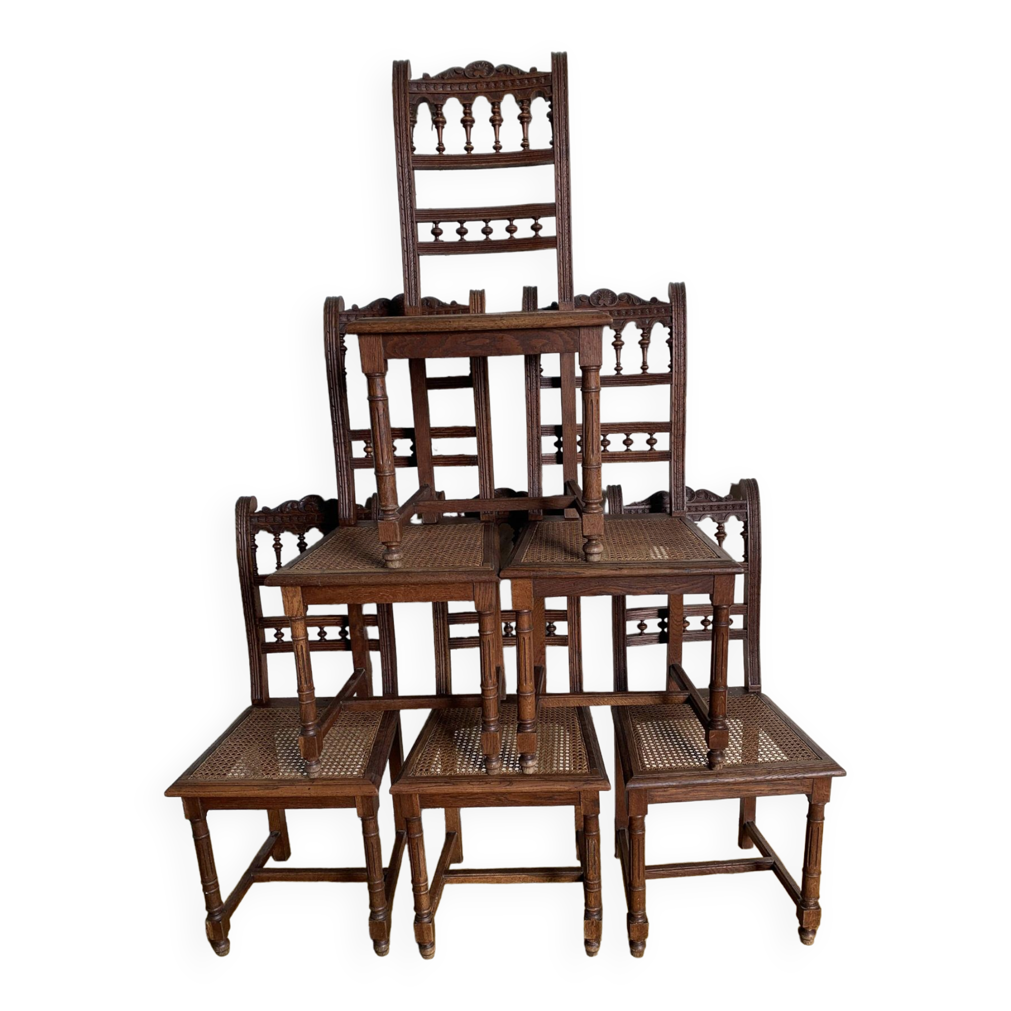 6 carved wooden chairs with cane seats