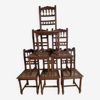 6 carved wooden chairs with cane seats