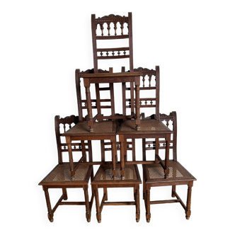 6 carved wooden chairs with cane seats