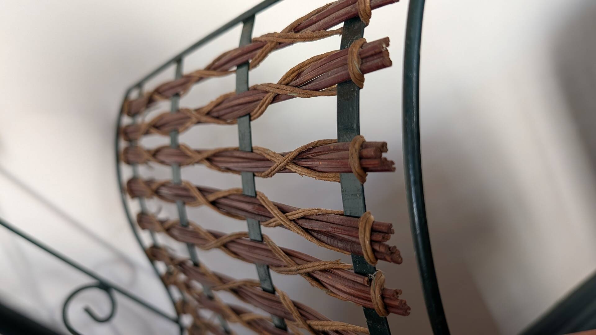 Metal and woven rattan magazine rack from the 60s.
