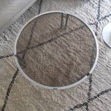 Round coffee table in smoked glass with chrome legs