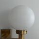Double opal glass and heavy brass, large minimalist cinema wall light, 1960s, Germany