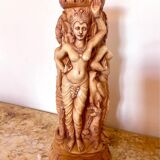 Two ancient Indonesian candlesticks.