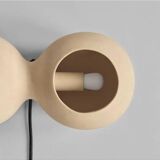 Table lamp or wall lamp in sand color made of ceramic, contemporary work.