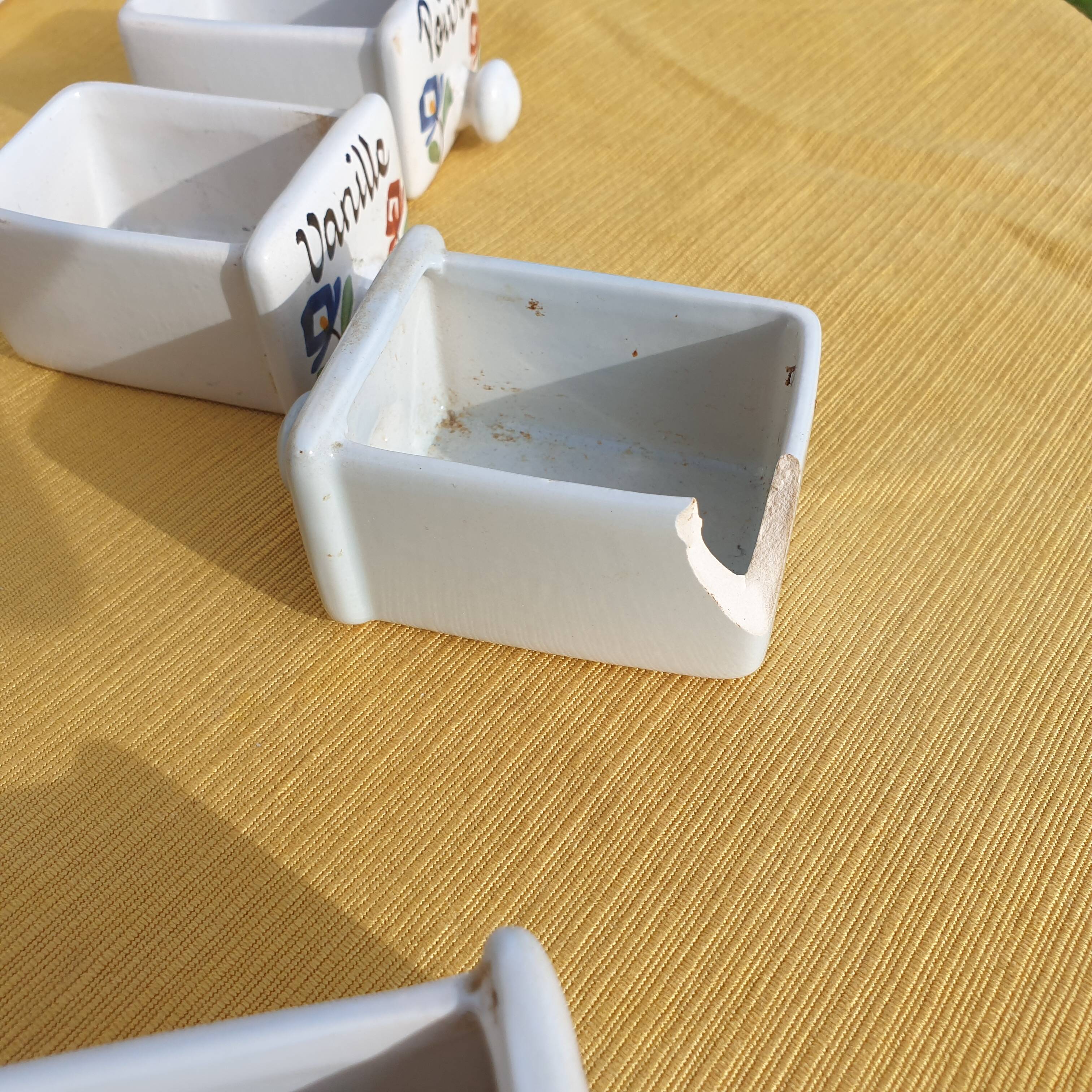 Vintage wooden spice rack with ceramic drawers