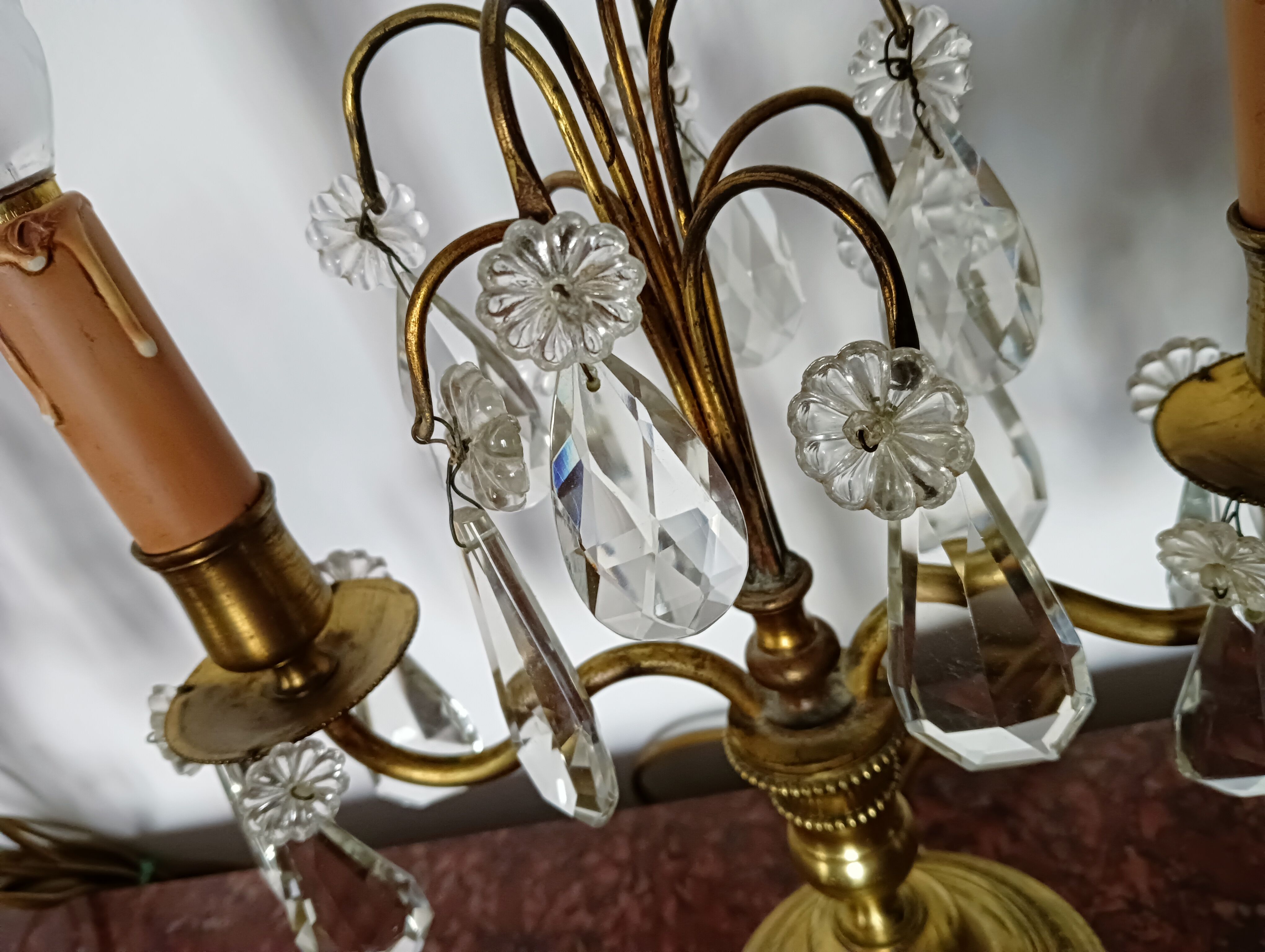 Pair of bronze girandoles with crystal pendants, two arms of lights.