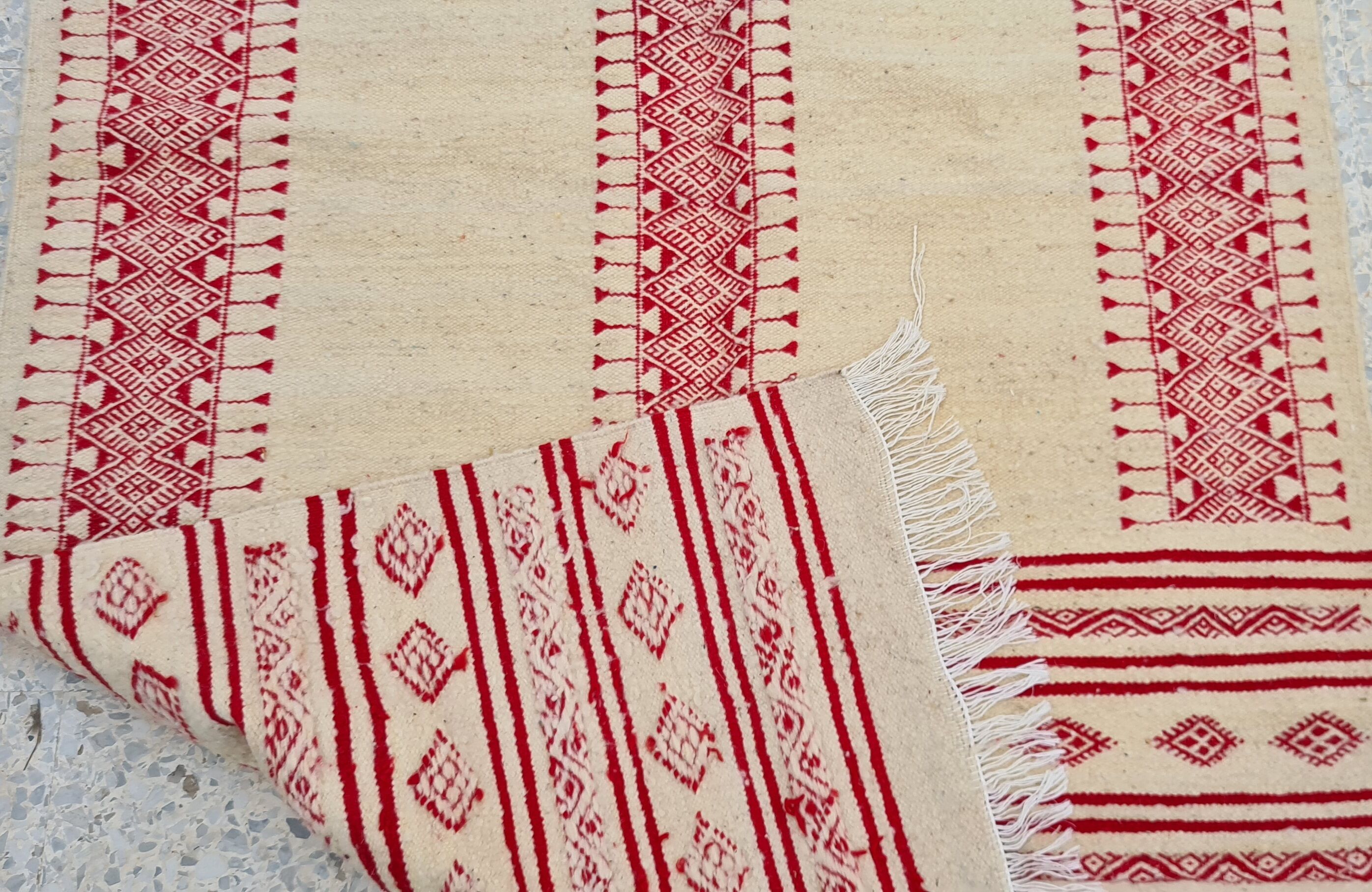 Traditional ethnic-patterned red and white carpet
