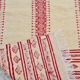 Traditional ethnic-patterned red and white carpet