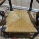 Pair of rustic straw-seated armchairs