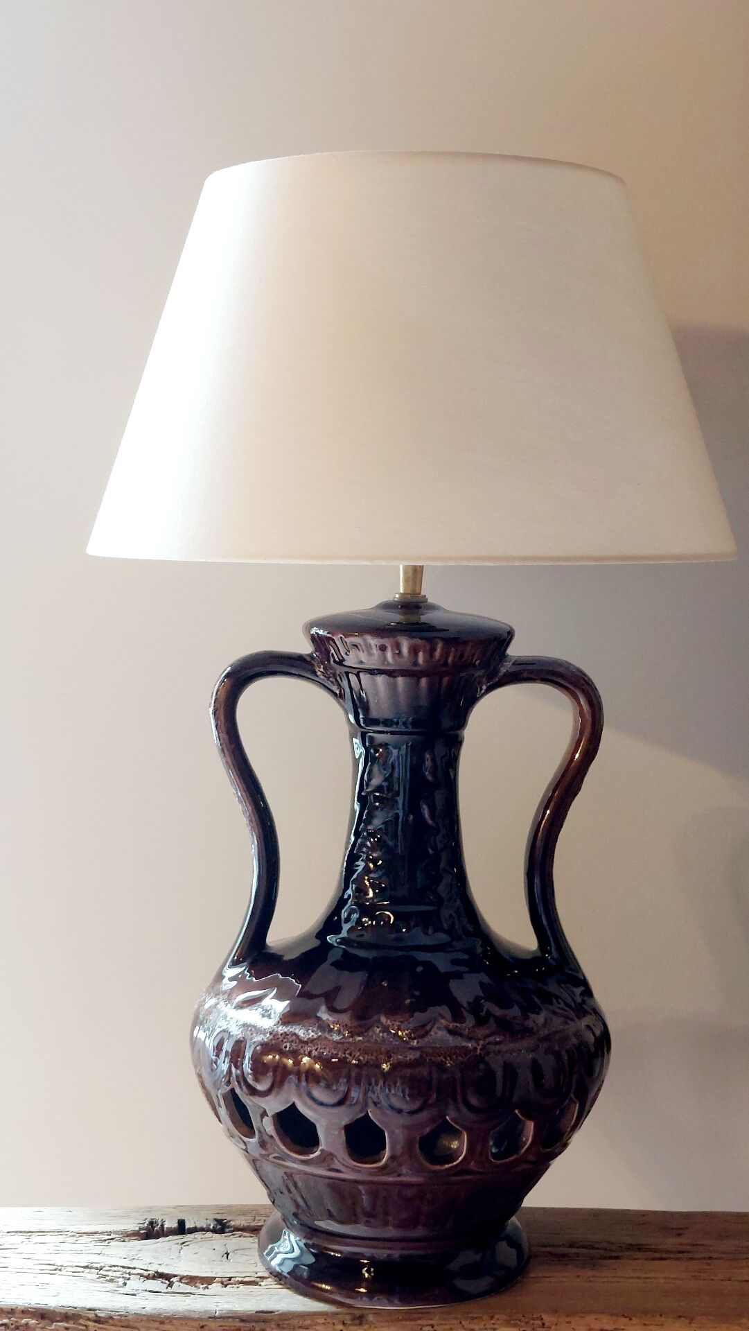 Vintage ceramic lamp with striped cotton shade.