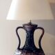 Vintage ceramic lamp with striped cotton shade.