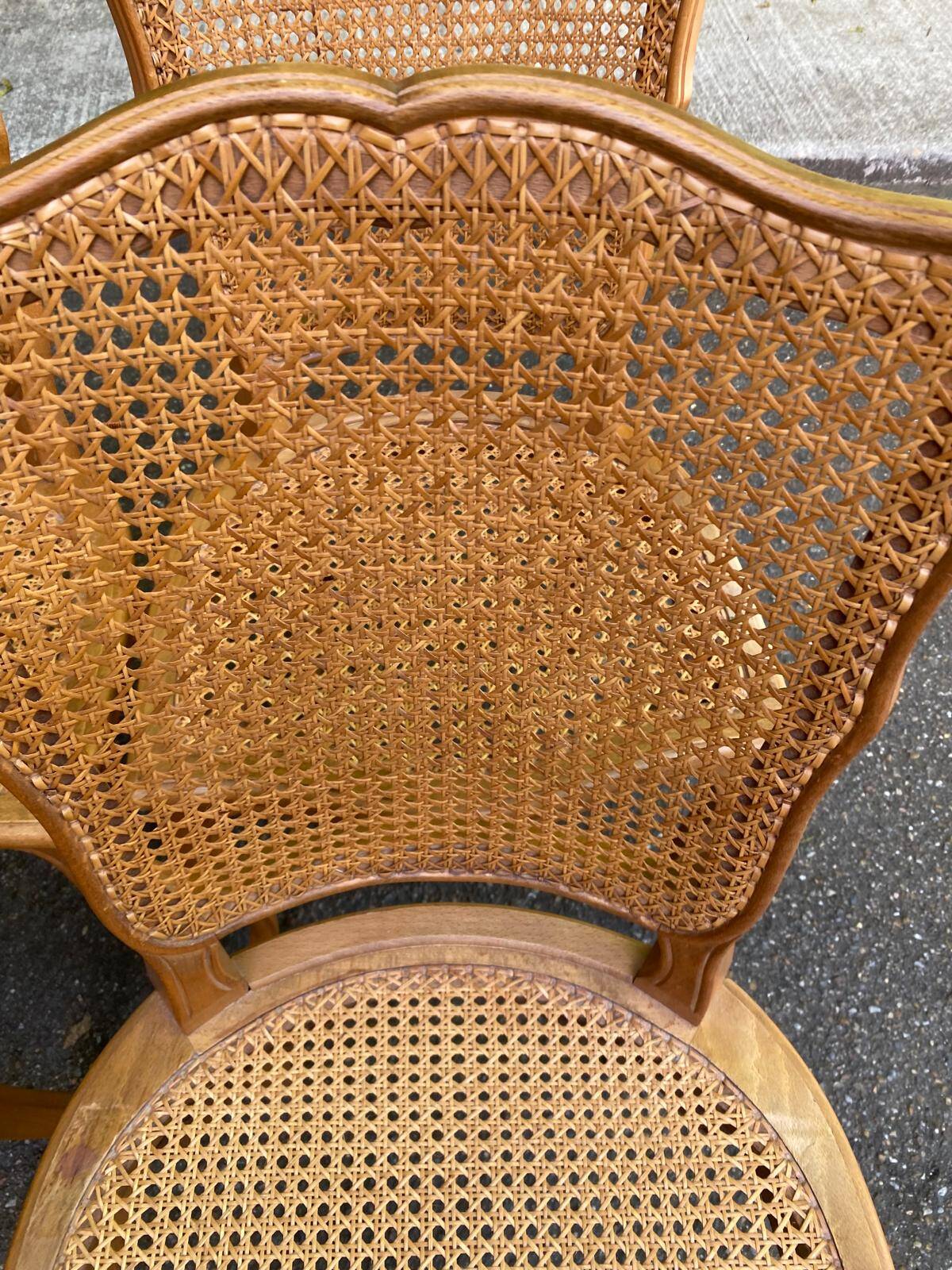4 Louis XV dining chairs in light solid oak with caning.