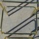Nested table in gold metal and glass