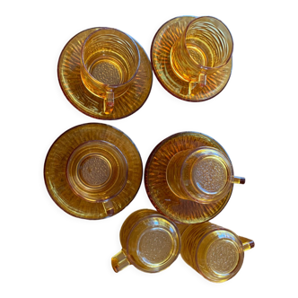 6 brown glass cups and saucers