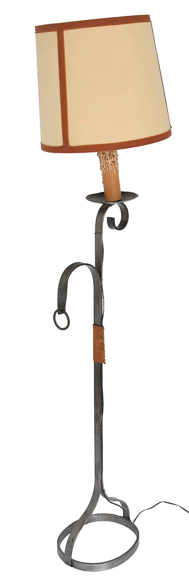 Wrought iron and leather floor lamp in the style of Jean-Pierre Ryckaert.