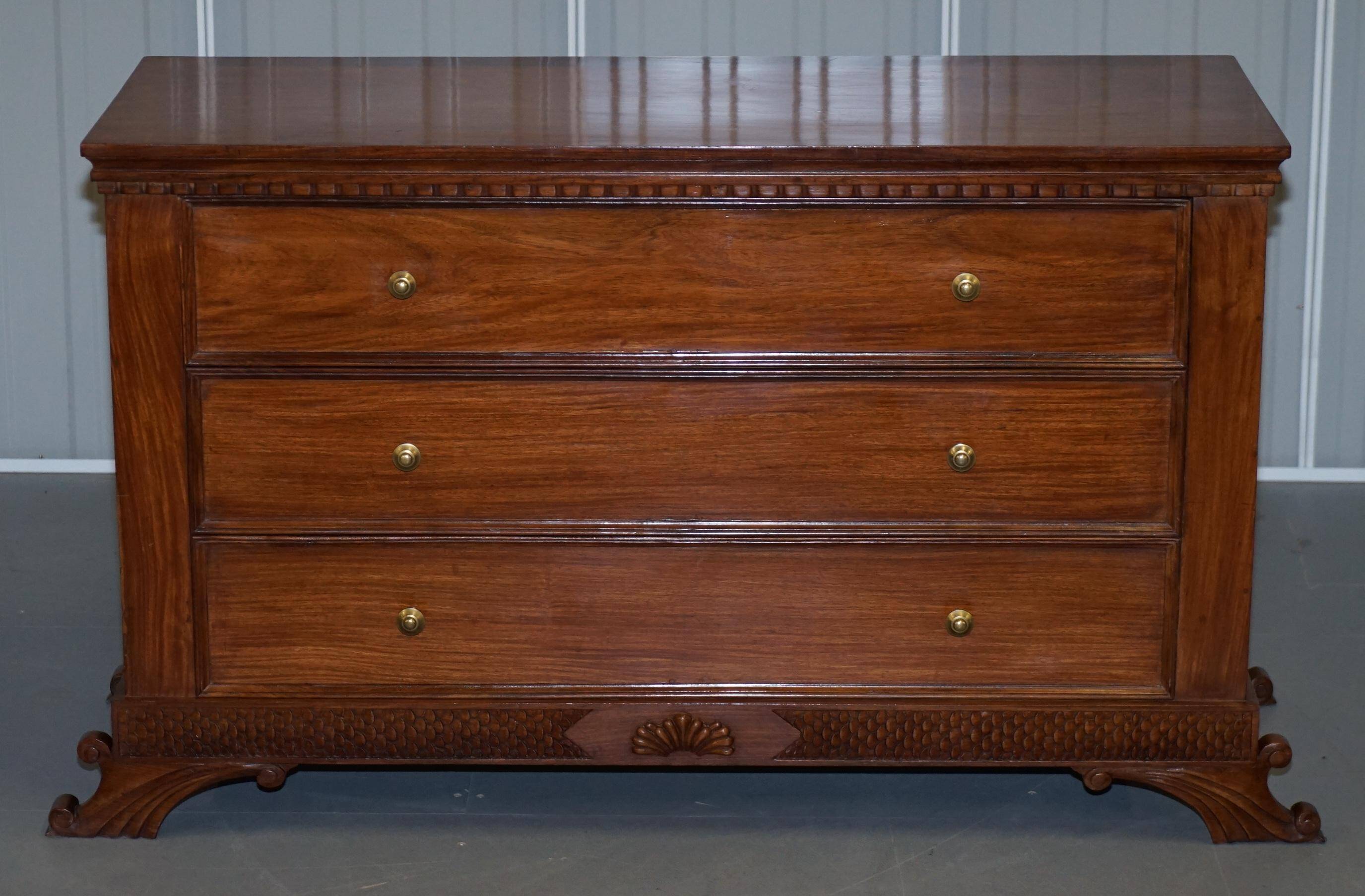 Set of hardwood dressers with finely carved bases.