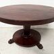 Empire style round table with claw feet, 19th century.