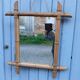 Antique wall mirror with a wooden frame