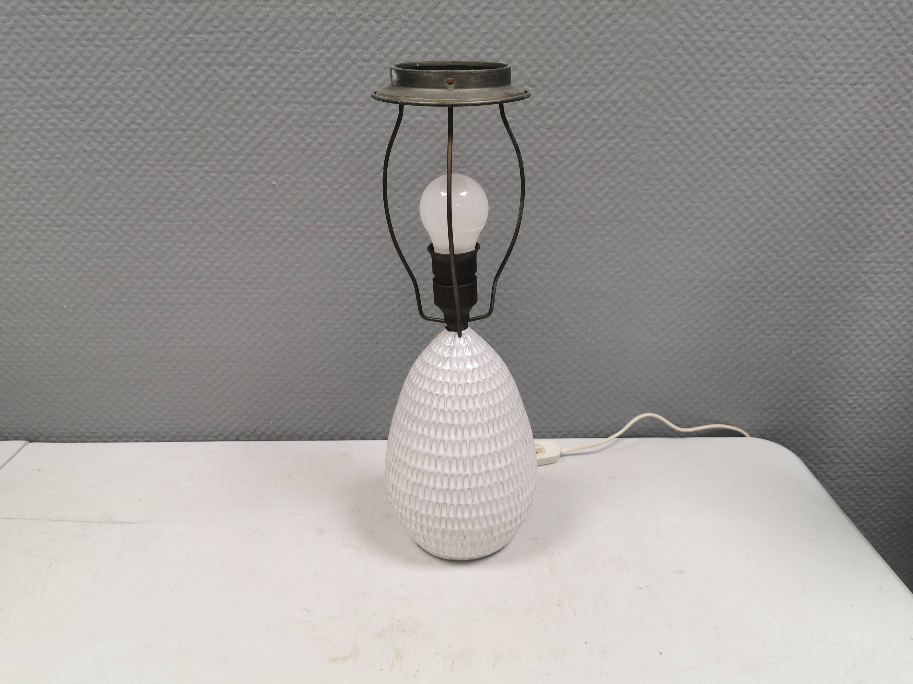 Older ceramic table lamp with beautiful details.