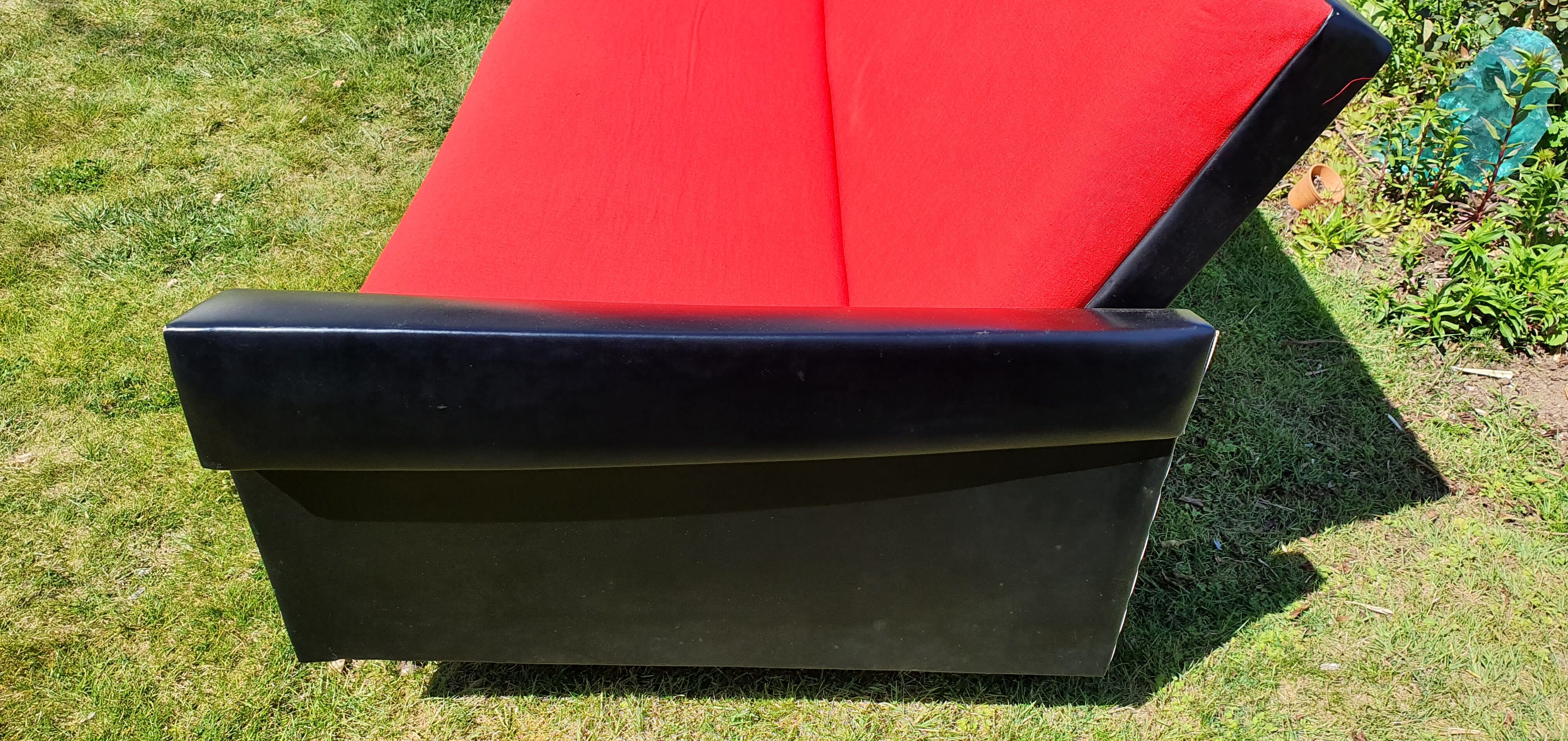 Vintage sofa 3 places convertible, red fabric and black skaï.1960s.