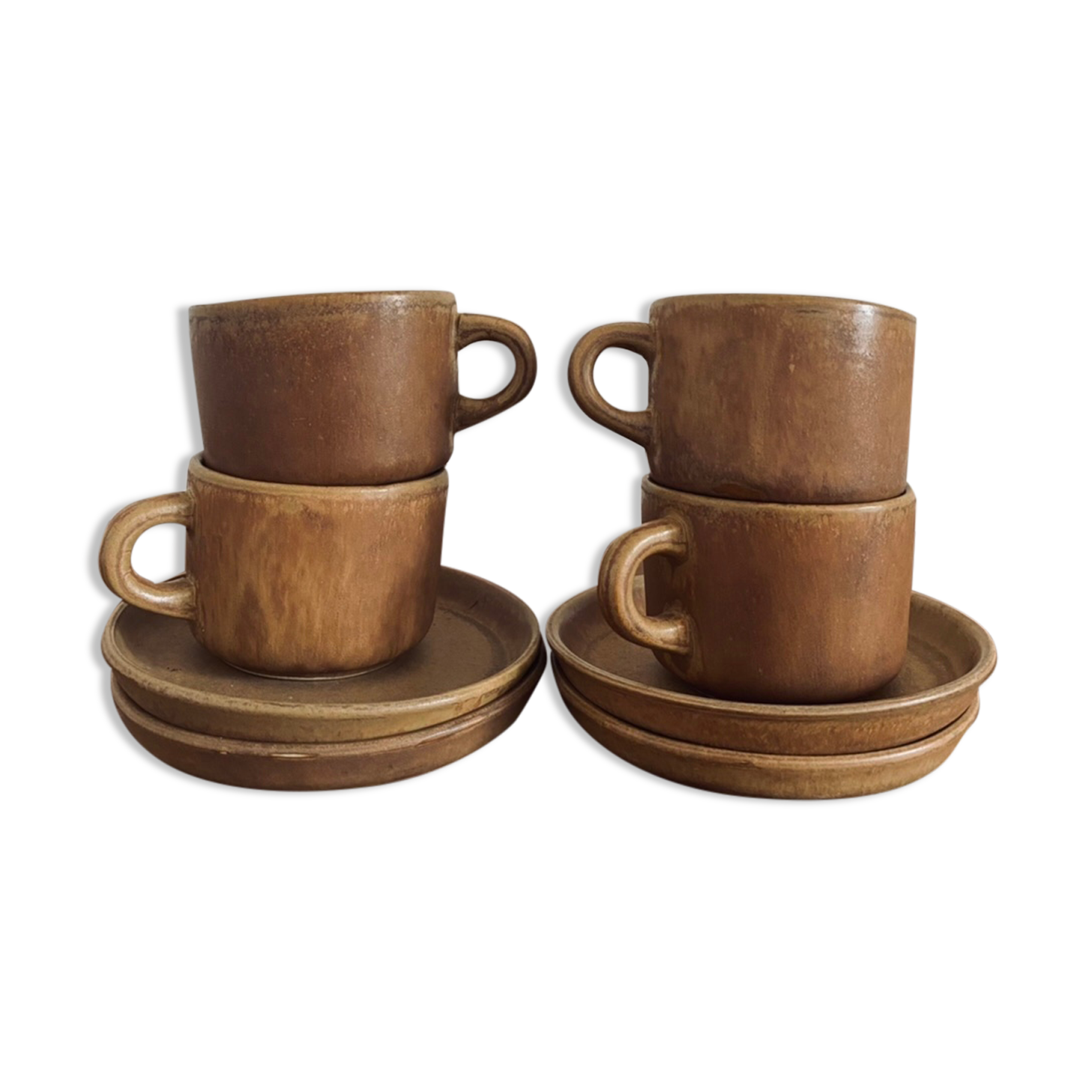 4 stoneware coffee cups and saucers