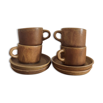 4 stoneware coffee cups and saucers