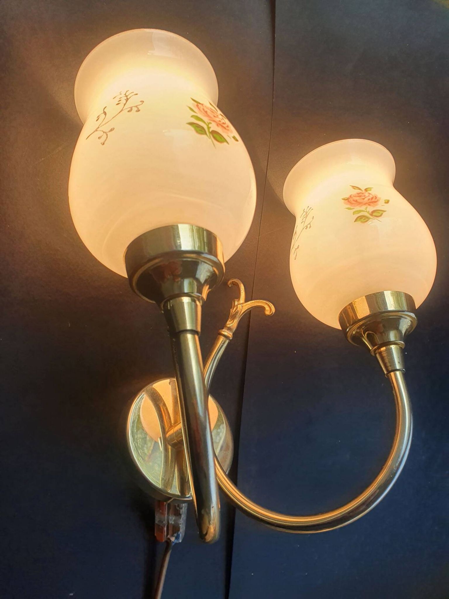Pair of vintage wall sconces in gilded brass and pink opaline glass.