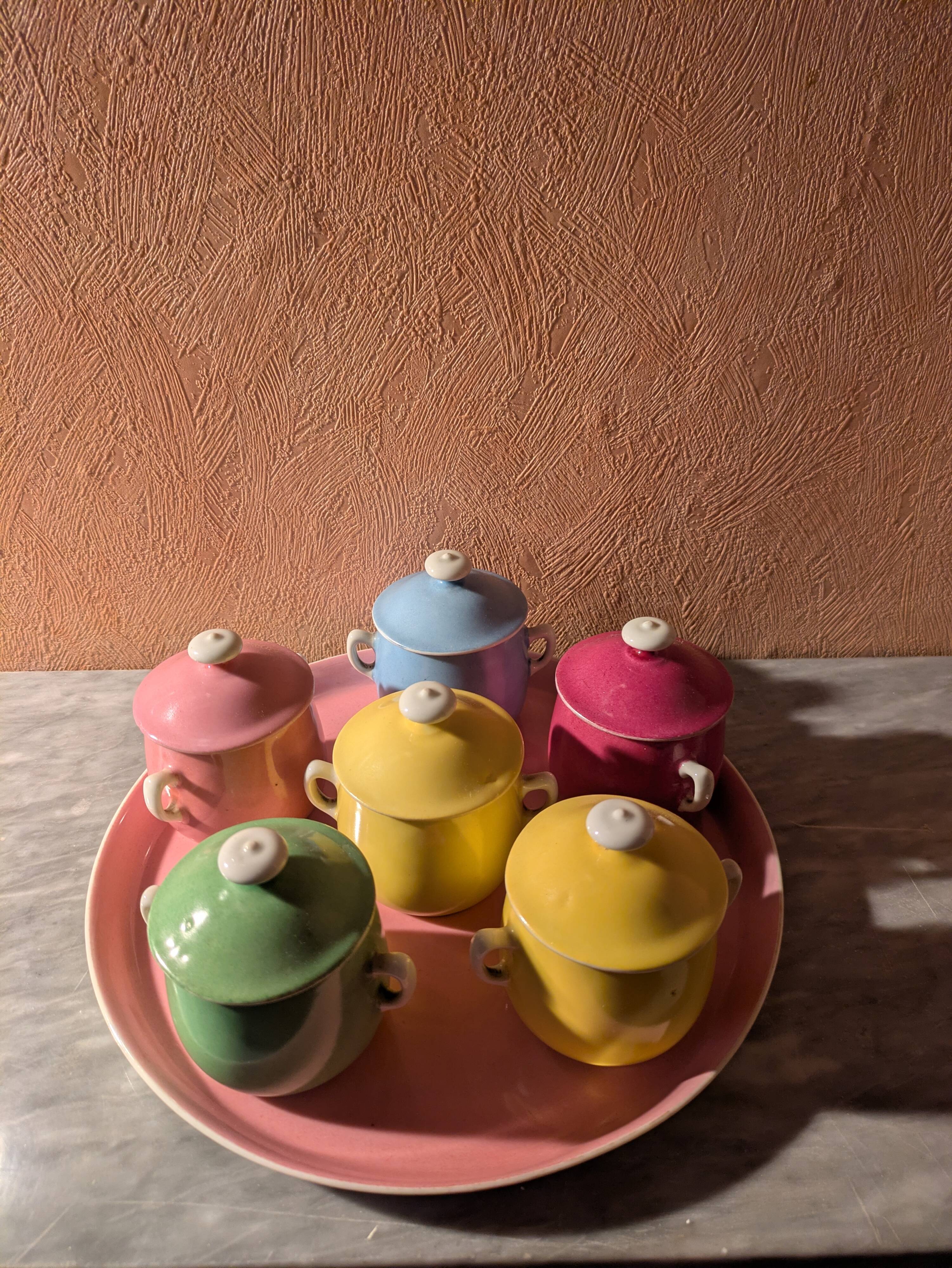 6 small porcelain cream pots from Limoges with a tray.