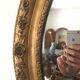 Miroir ovoïde dorure a la feuille d'or, debut xxème