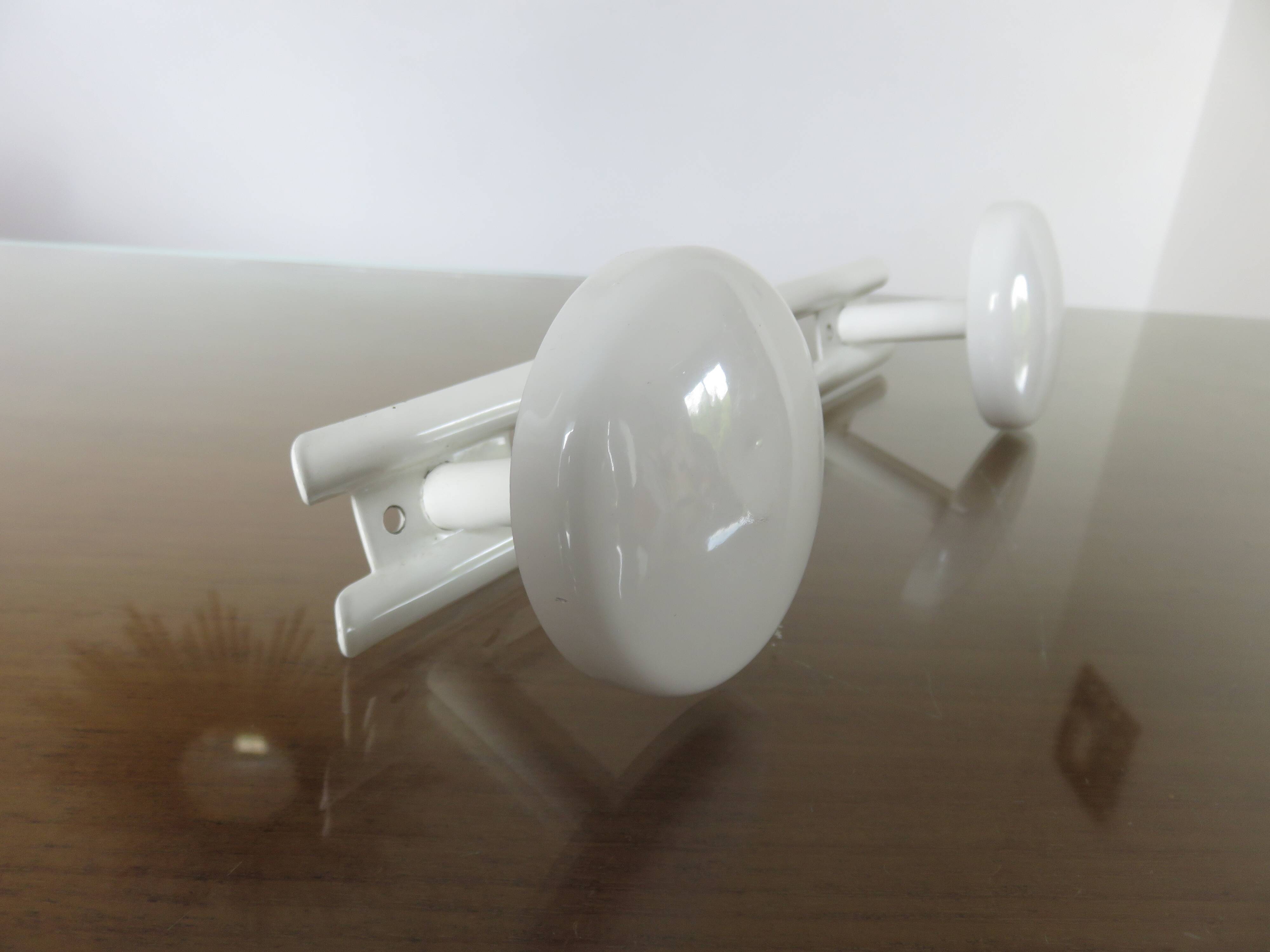 Wall coat rack in white lacquered metal with 2 hooks, 1970.