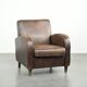 Comfortable sheepskin armchair with matching piping and a timeless look