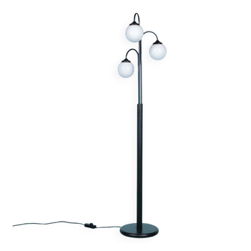 Minimalist floor lamp in glass, space age style.