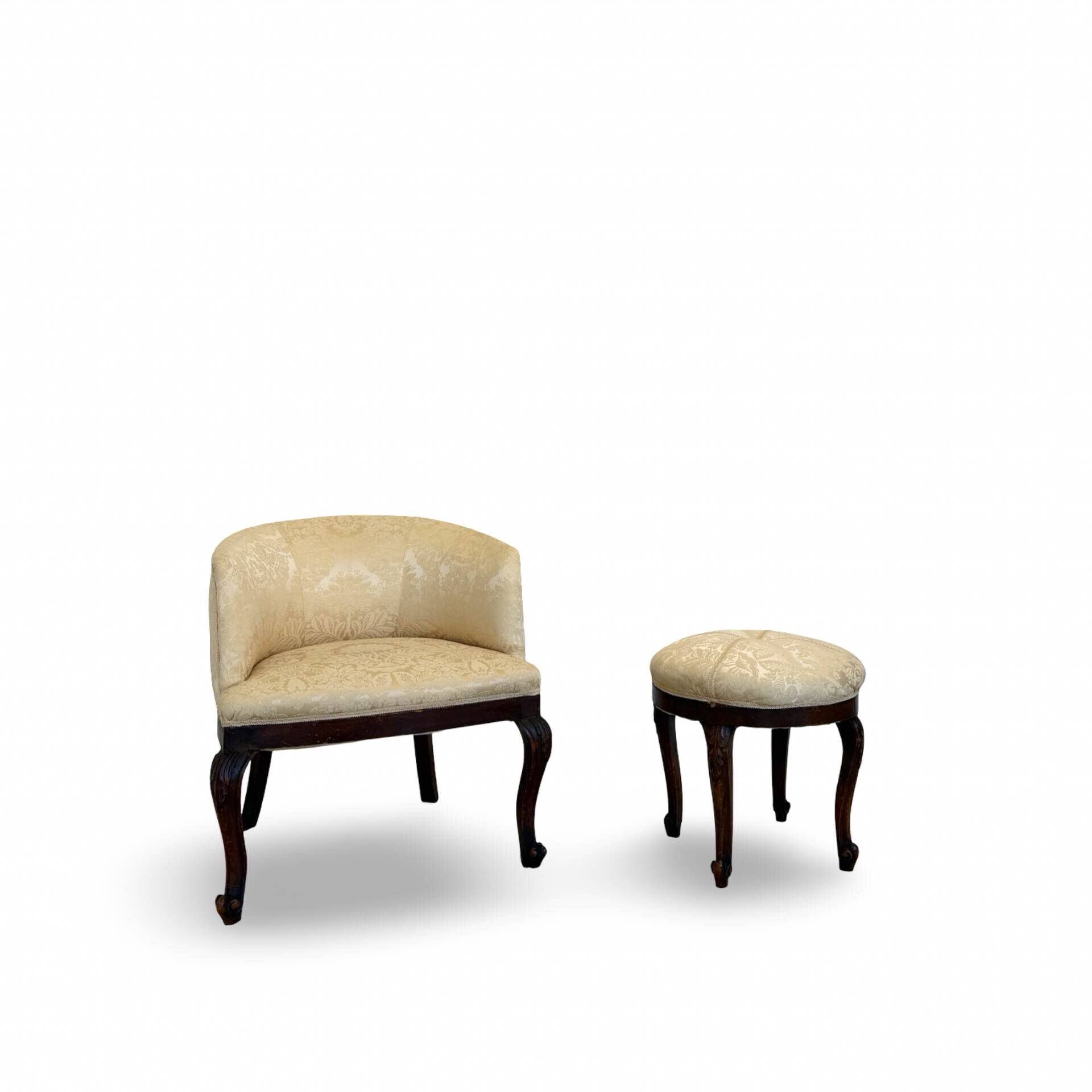An antique Italian bar chair and a matching tufted vanity stool.
