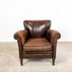 Fauteuil en cuir de mouton foncé fijnaart
