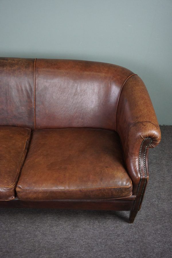 2-seater sofa in sheepskin decorative nails