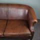 2-seater sofa in sheepskin decorative nails