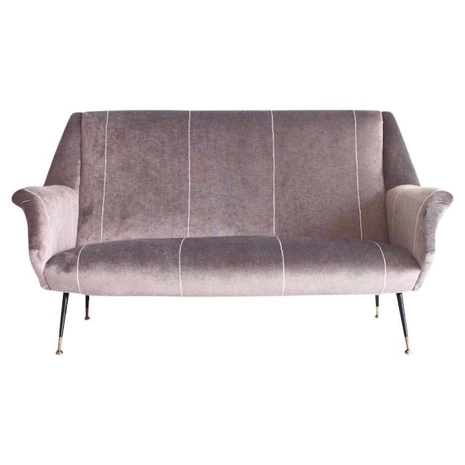Italian velvet sofa in grey with black lacquered brass legs.
