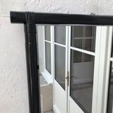 Black lacquered rattan mirror