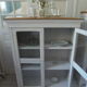 Showcase, bookcase, vintage pearl grey patinated cupboard, wooden top.