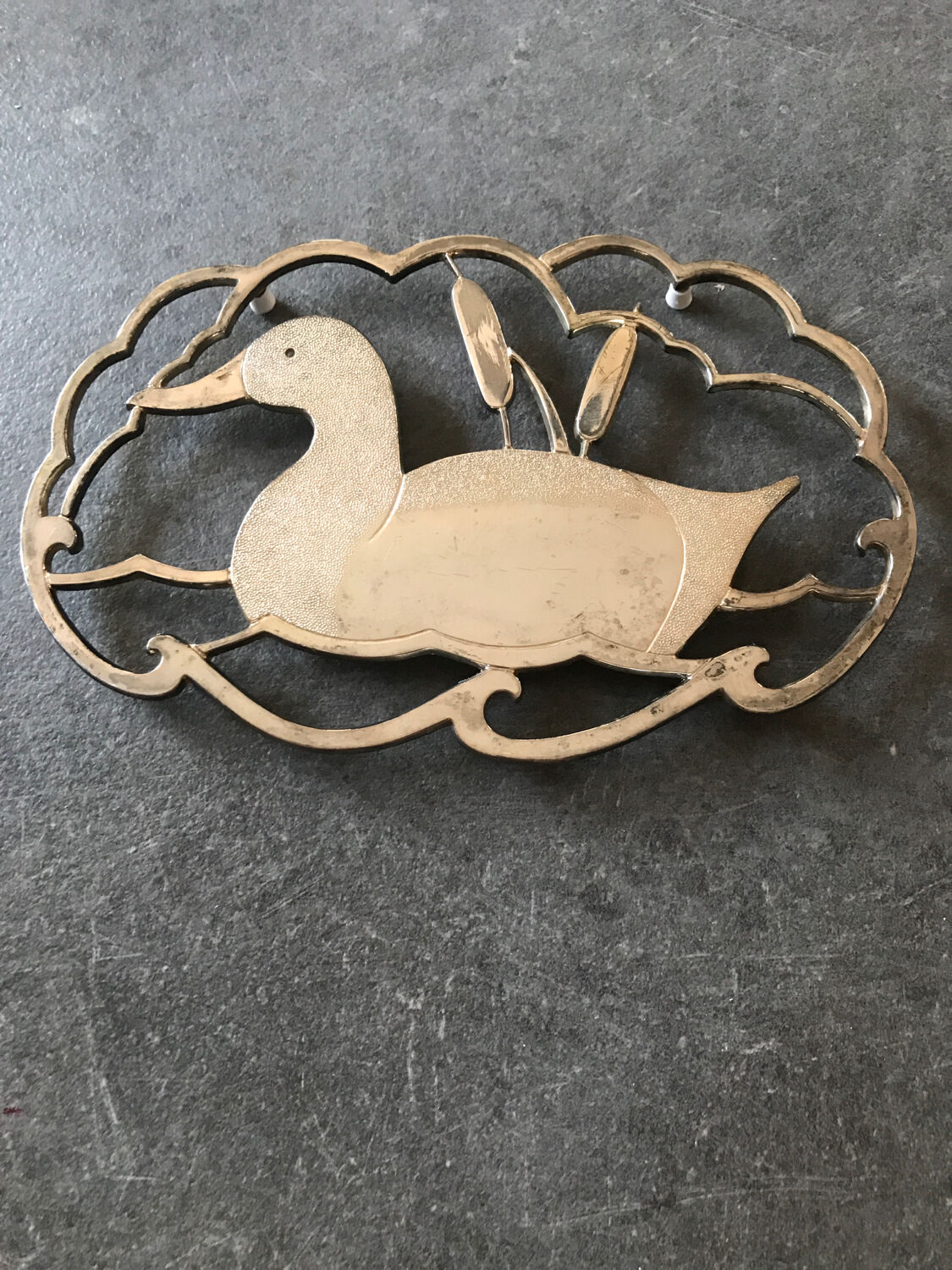 Silver metal duck trivet