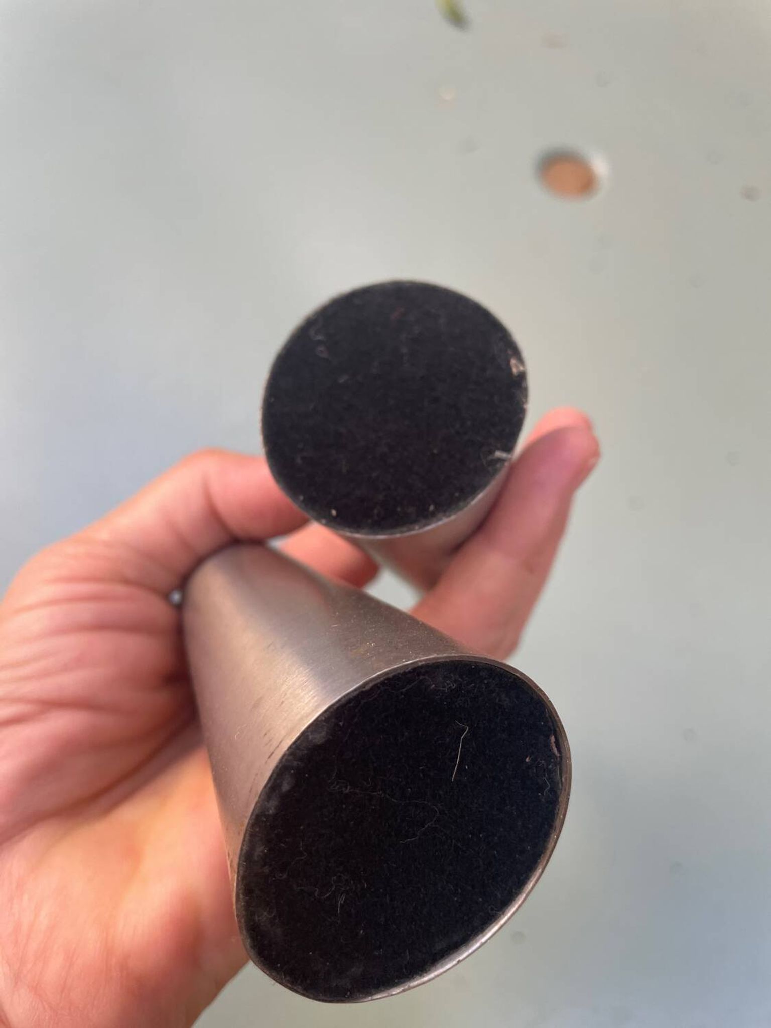Pair of aluminum candlesticks