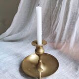 Large hand candlestick in gilded brass